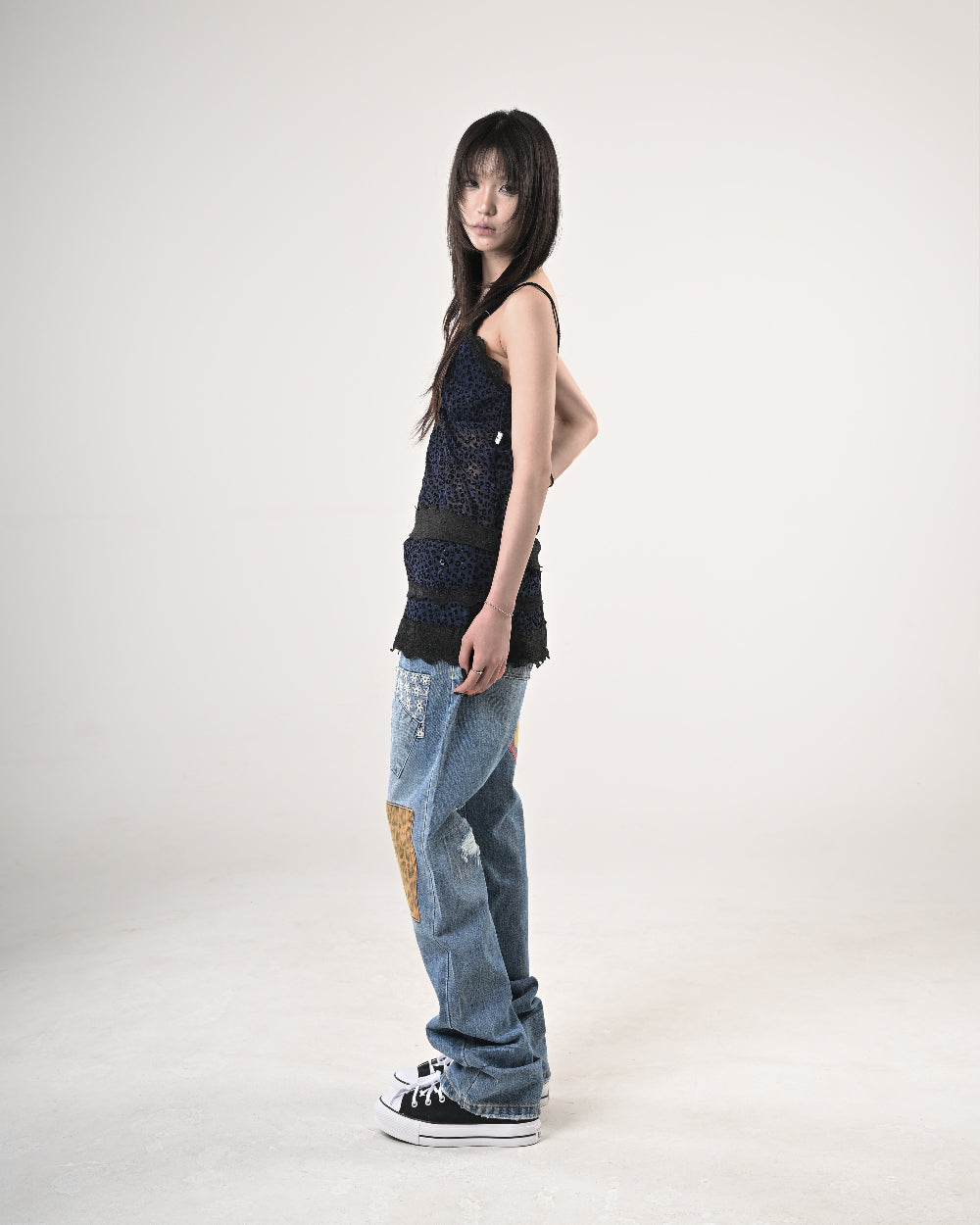 11 PATCHED DENIM PANTS